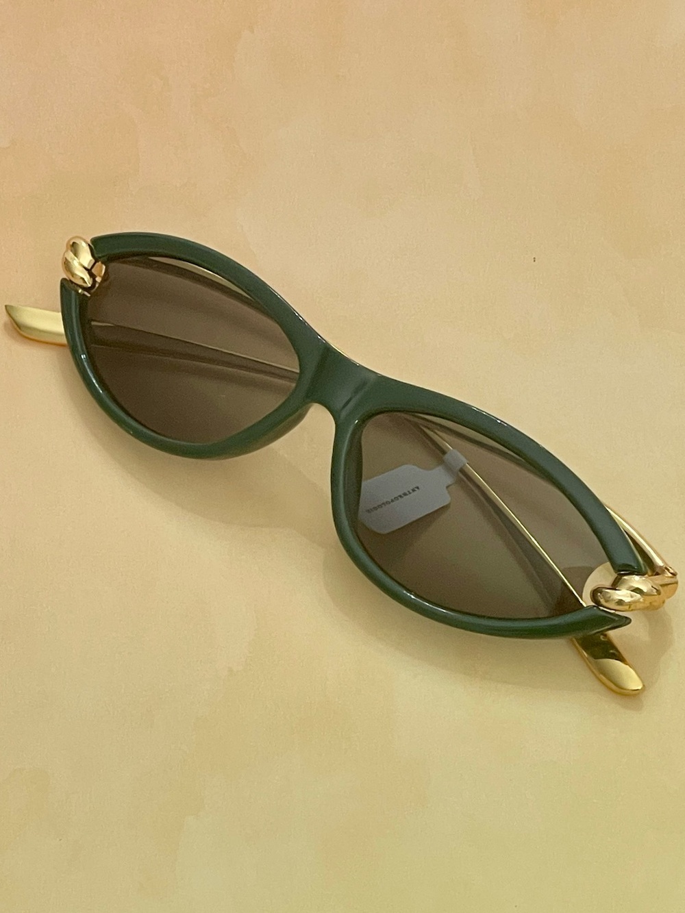 Anthropologie Dark Green Slim Oval Cat Eye Sunglasses with Gold Knotted Arms